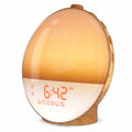 Wood grain sunrise alarm clock with a warm amber sunrise simulation glow