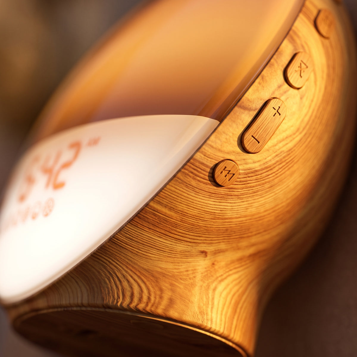 Close-up of the warm wood-grain finish and controls of the sunrise clock